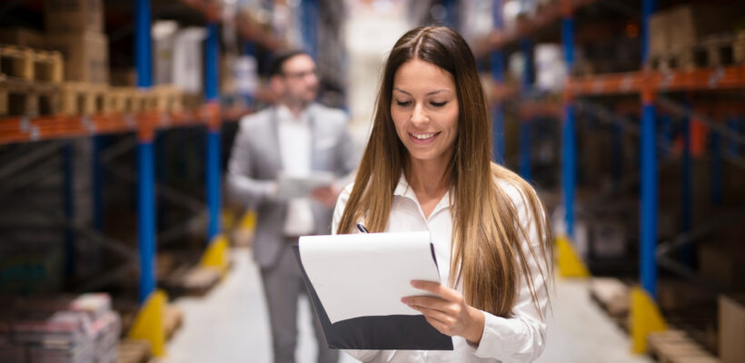 portrait-gorgeous-brunette-woman-manager-controlling-business-warehouse-logistic-center-well-dressed-successful-woman-checking-distribution-while-ceo-walking-her (1)